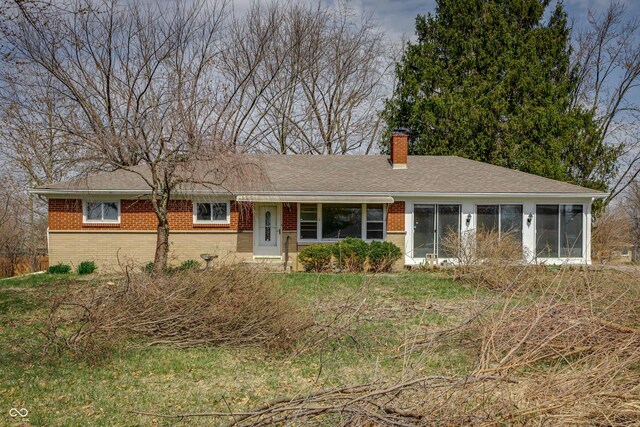 3510 Chamberlin Dr, Indianapolis, IN 46237 - single story home featuring roof with shingles, a chimney, a sunroom, and brick siding