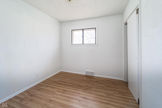3510 Chamberlin Dr, Indianapolis, IN 46237 - unfurnished bedroom featuring baseboards, a closet, light wood finished floors, and visible vents
