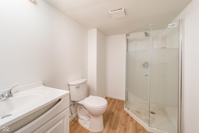 3510 Chamberlin Dr, Indianapolis, IN 46237 - full bath with a stall shower, toilet, wood finished floors, and visible vents