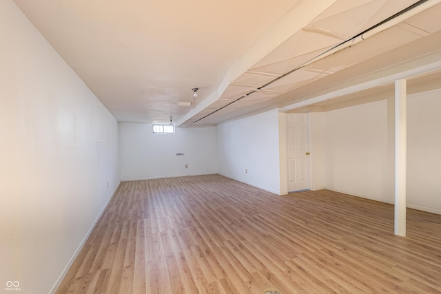 3510 Chamberlin Dr, Indianapolis, IN 46237 - below grade area with baseboards and light wood-style flooring