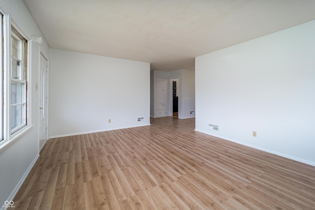 3510 Chamberlin Dr, Indianapolis, IN 46237 - unfurnished room with baseboards, light wood finished floors, and visible vents