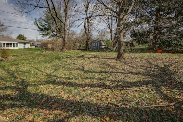 3510 Chamberlin Dr, Indianapolis, IN 46237 - view of yard with a storage unit and an outdoor structure