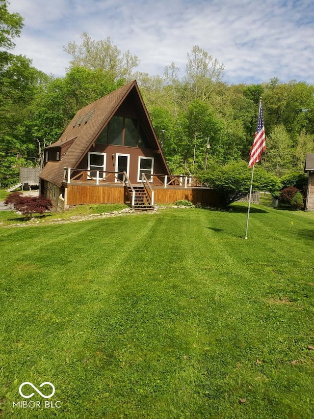 304 Oakridge Dr, North Vernon, IN 47265 - back of property featuring a deck and a yard