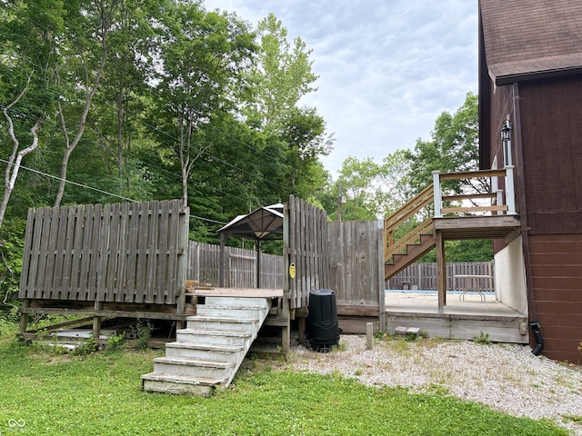304 Oakridge Dr, North Vernon, IN 47265 - view of yard with stairs and a wooden deck