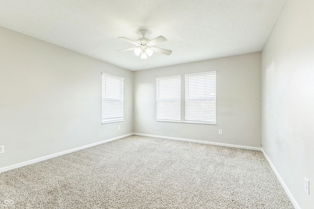 4747 Summit Lake Pl, Indianapolis, IN 46239 - spare room featuring baseboards, carpet flooring, and a ceiling fan
