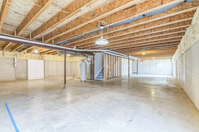 4747 Summit Lake Pl, Indianapolis, IN 46239 - unfinished below grade area featuring water heater and stairway