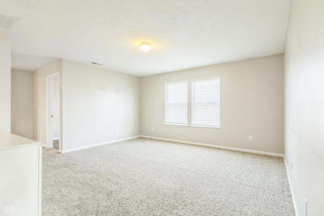 4747 Summit Lake Pl, Indianapolis, IN 46239 - empty room with baseboards, visible vents, and light carpet