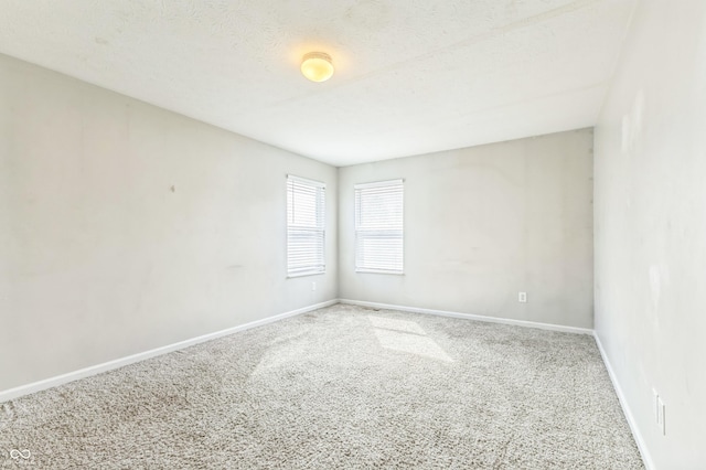 4747 Summit Lake Pl, Indianapolis, IN 46239 - empty room featuring baseboards, a textured ceiling, and carpet