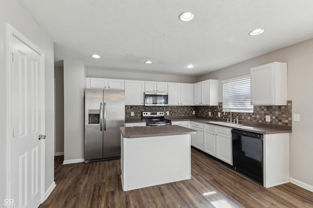 4747 Summit Lake Pl, Indianapolis, IN 46239 - kitchen featuring a sink, white cabinetry, dark countertops, and appliances with stainless steel finishes