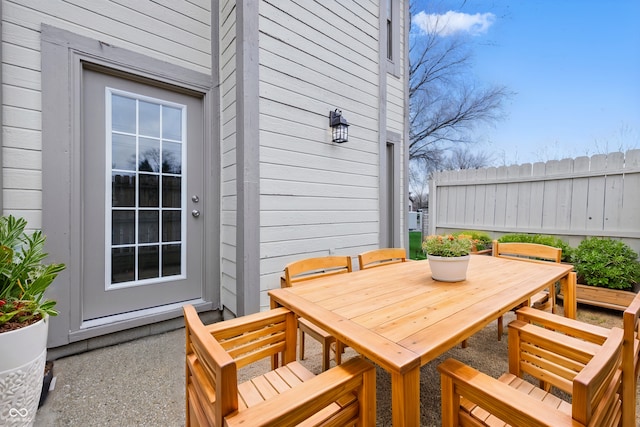 6059 S Bay Dr, Indianapolis, IN 46250 - view of patio / terrace with outdoor dining area and fence