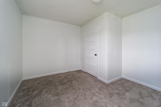 2134 Dawson St, Indianapolis, IN 46203 - carpeted empty room featuring baseboards and ornamental molding