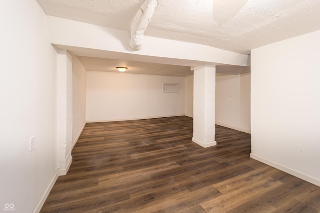 2134 Dawson St, Indianapolis, IN 46203 - finished basement featuring a textured ceiling, baseboards, and wood finished floors