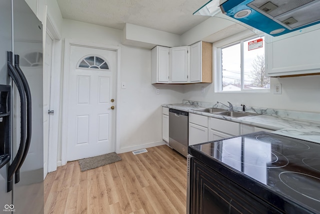 2134 Dawson St, Indianapolis, IN 46203 - kitchen featuring a sink, black range with electric cooktop, stainless steel dishwasher, refrigerator with ice dispenser, and visible vents