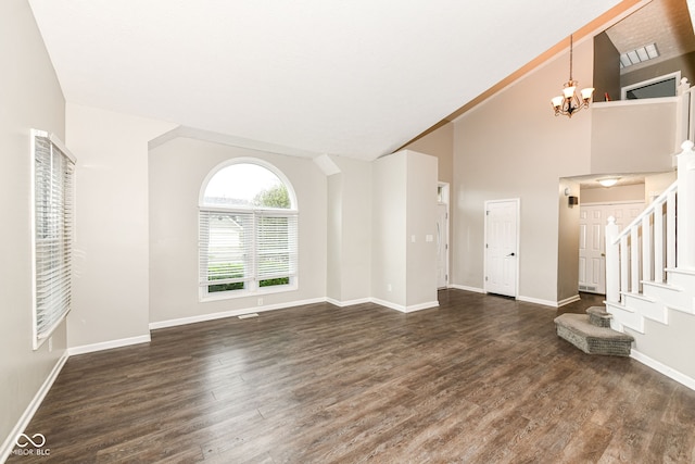 unfurnished living room featuring baseboards, a chandelier, wood finished floors, stairs, and high vaulted ceiling