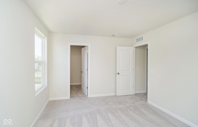 3241 Fawn Cir, Brownsburg, IN 46112 - unfurnished bedroom featuring a spacious closet, carpet floors, and baseboards