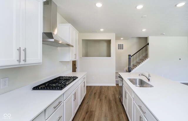 3241 Fawn Cir, Brownsburg, IN 46112 - kitchen with a sink, wall chimney range hood, gas cooktop, dark wood-style flooring, and stainless steel dishwasher