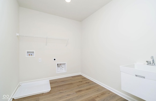 3241 Fawn Cir, Brownsburg, IN 46112 - washroom featuring electric dryer hookup, hookup for a washing machine, light wood-type flooring, and baseboards