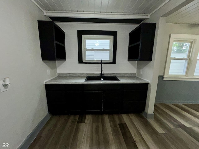 1627 E 8th St, Anderson, IN 46012 - kitchen featuring open shelves, dark cabinets, dark wood-style flooring, and a sink