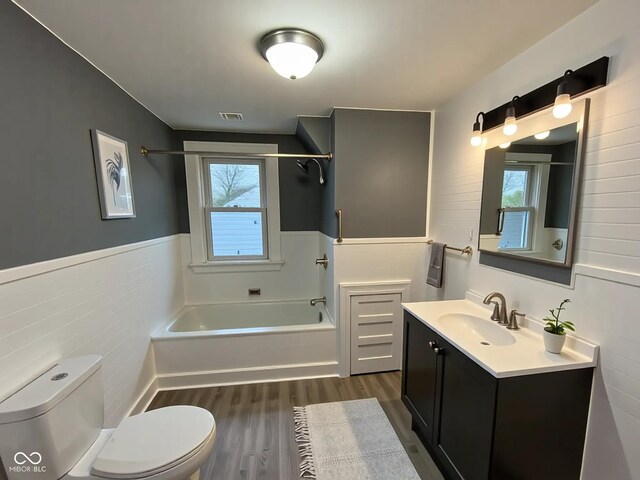 1627 E 8th St, Anderson, IN 46012 - bathroom with toilet, visible vents, plenty of natural light, and wood finished floors