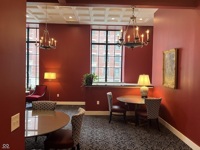 dining area with baseboards, recessed lighting, and an inviting chandelier