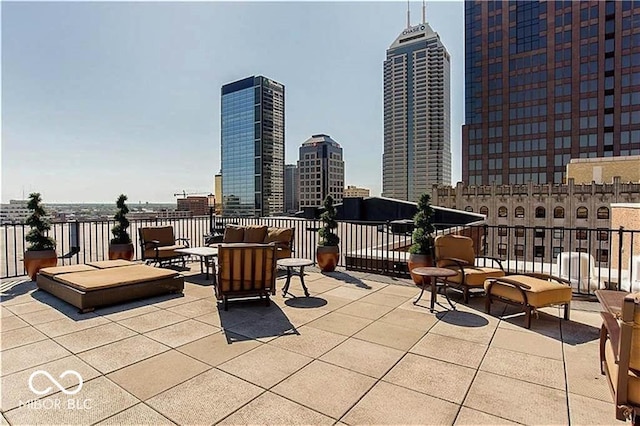 view of patio with an outdoor living space and a city view