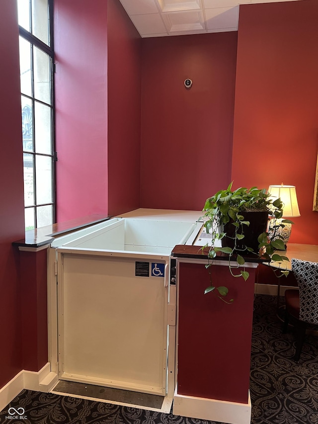 misc room featuring a wealth of natural light and baseboards