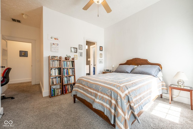 carpeted bedroom featuring ceiling fan, visible vents, and baseboards