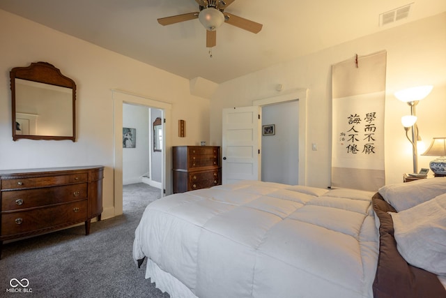 carpeted bedroom featuring baseboards, ceiling fan, and visible vents