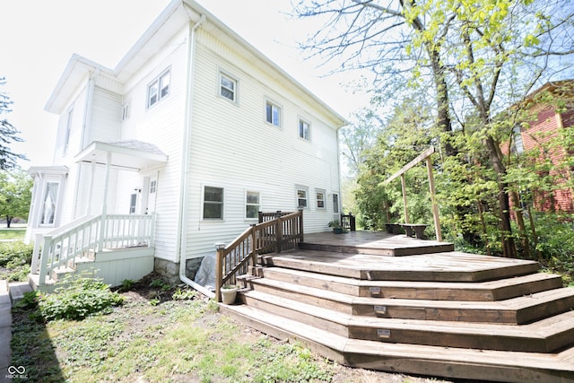 back of property with a wooden deck