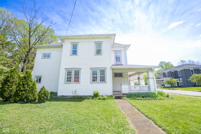 view of front of home featuring a porch and a front yard