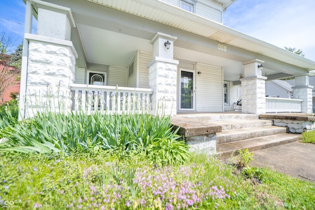 doorway to property with a porch