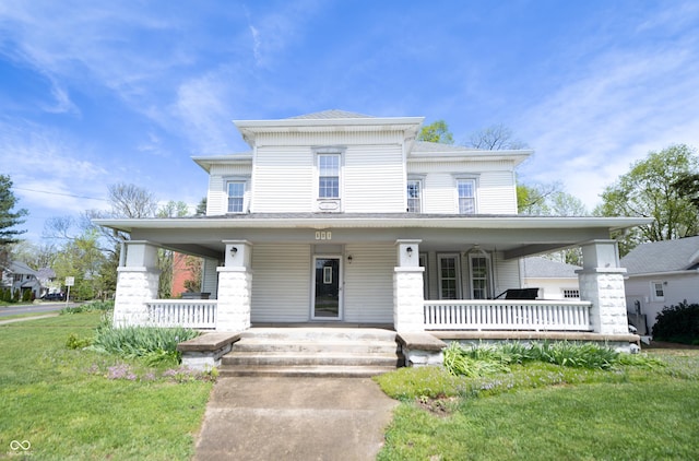 italianate home with a porch and a front yard