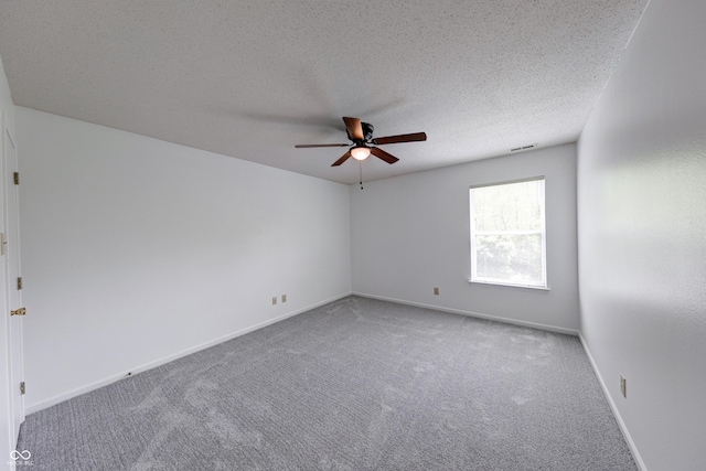 5989 Ashmore Ln, Carmel, IN 46033 - empty room featuring a ceiling fan, carpet, a textured ceiling, and baseboards