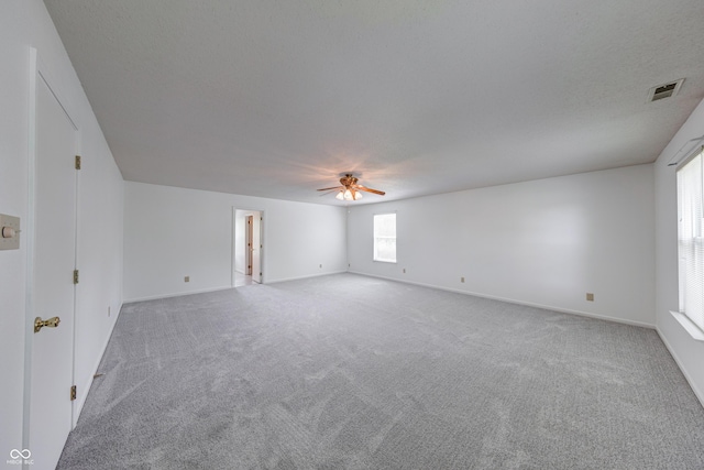 5989 Ashmore Ln, Carmel, IN 46033 - empty room featuring carpet flooring, a ceiling fan, and baseboards