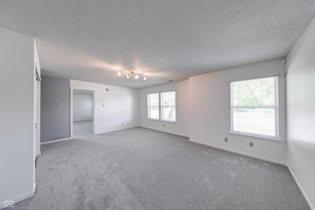 5989 Ashmore Ln, Carmel, IN 46033 - unfurnished room featuring carpet flooring, a textured ceiling, and baseboards