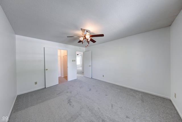 5989 Ashmore Ln, Carmel, IN 46033 - unfurnished bedroom featuring carpet floors, baseboards, and a textured ceiling