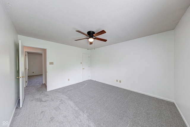 5989 Ashmore Ln, Carmel, IN 46033 - unfurnished bedroom with carpet floors, baseboards, and a ceiling fan