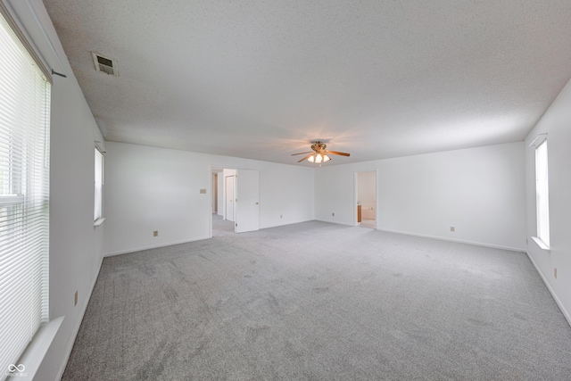 5989 Ashmore Ln, Carmel, IN 46033 - unfurnished room featuring a ceiling fan, carpet flooring, a textured ceiling, and baseboards