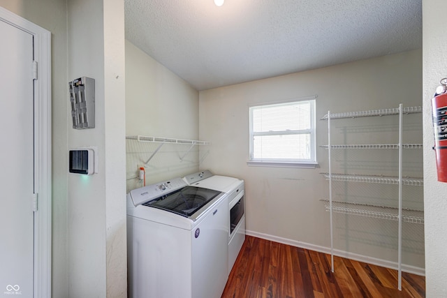 5989 Ashmore Ln, Carmel, IN 46033 - clothes washing area with washer and dryer, dark wood-style floors, baseboards, and a textured ceiling