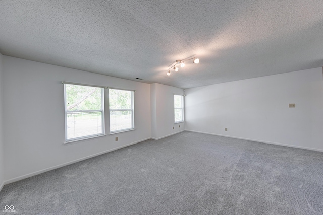 5989 Ashmore Ln, Carmel, IN 46033 - empty room with carpet flooring, a textured ceiling, and baseboards