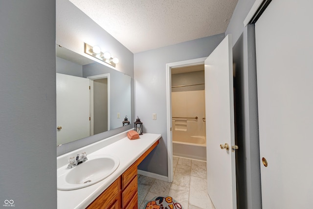 5989 Ashmore Ln, Carmel, IN 46033 - full bathroom with marble look tiles, vanity, baseboards, a textured ceiling, and washtub / shower combination