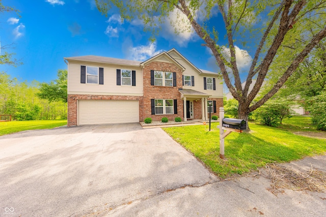 5989 Ashmore Ln, Carmel, IN 46033 - view of front of property featuring asphalt driveway, brick siding, a garage, and a front lawn