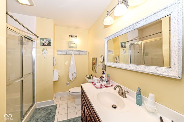 full bathroom featuring tile patterned flooring, vanity, toilet, baseboards, and a stall shower