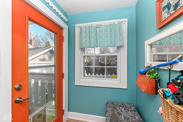 entryway featuring baseboards