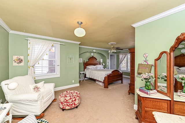 bedroom featuring baseboards, light colored carpet, ornamental molding, and multiple windows