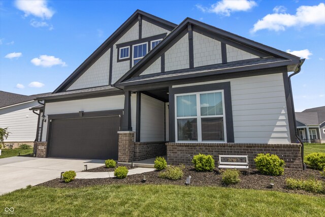 15755 Scher Dr, Westfield, IN 46074 - craftsman-style home with brick siding, driveway, and a garage