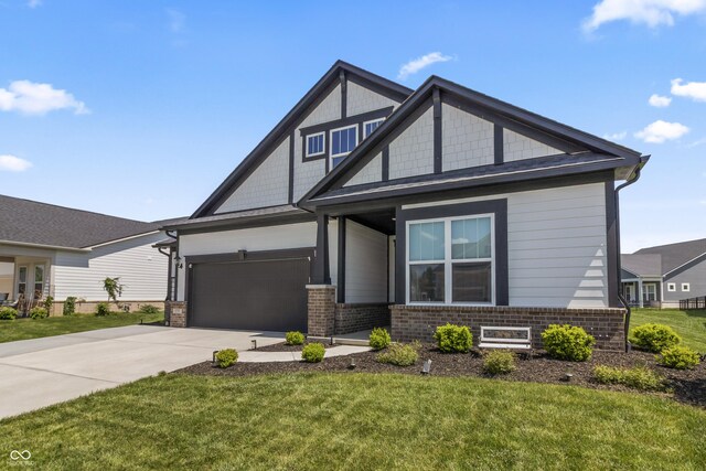 15755 Scher Dr, Westfield, IN 46074 - view of front of home with concrete driveway, a front lawn, an attached garage, and brick siding