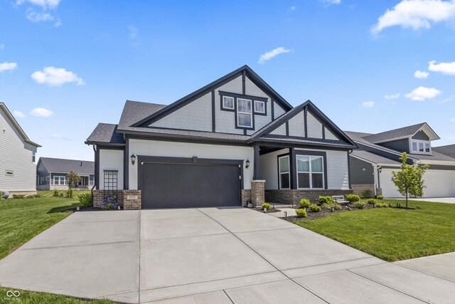 15755 Scher Dr, Westfield, IN 46074 - view of front of home with brick siding, driveway, and a front lawn