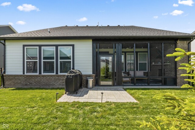 15755 Scher Dr, Westfield, IN 46074 - back of property featuring brick siding, a sunroom, a patio area, and a lawn