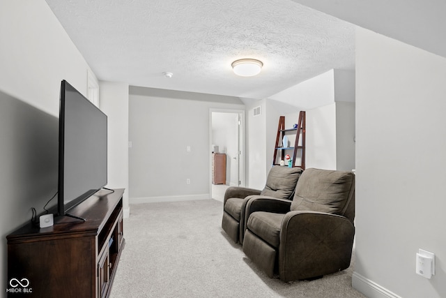 358 Terrace Ave, Indianapolis, IN 46225 - living room featuring a textured ceiling, baseboards, light colored carpet, and visible vents
